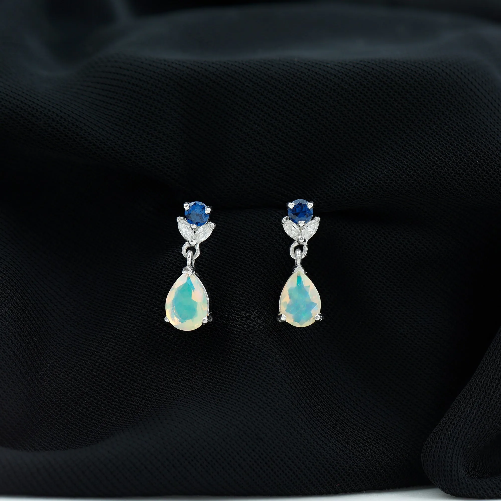 Ethiopian Opal and Created Blue Sapphire Dangle Earrings with Moissanite
