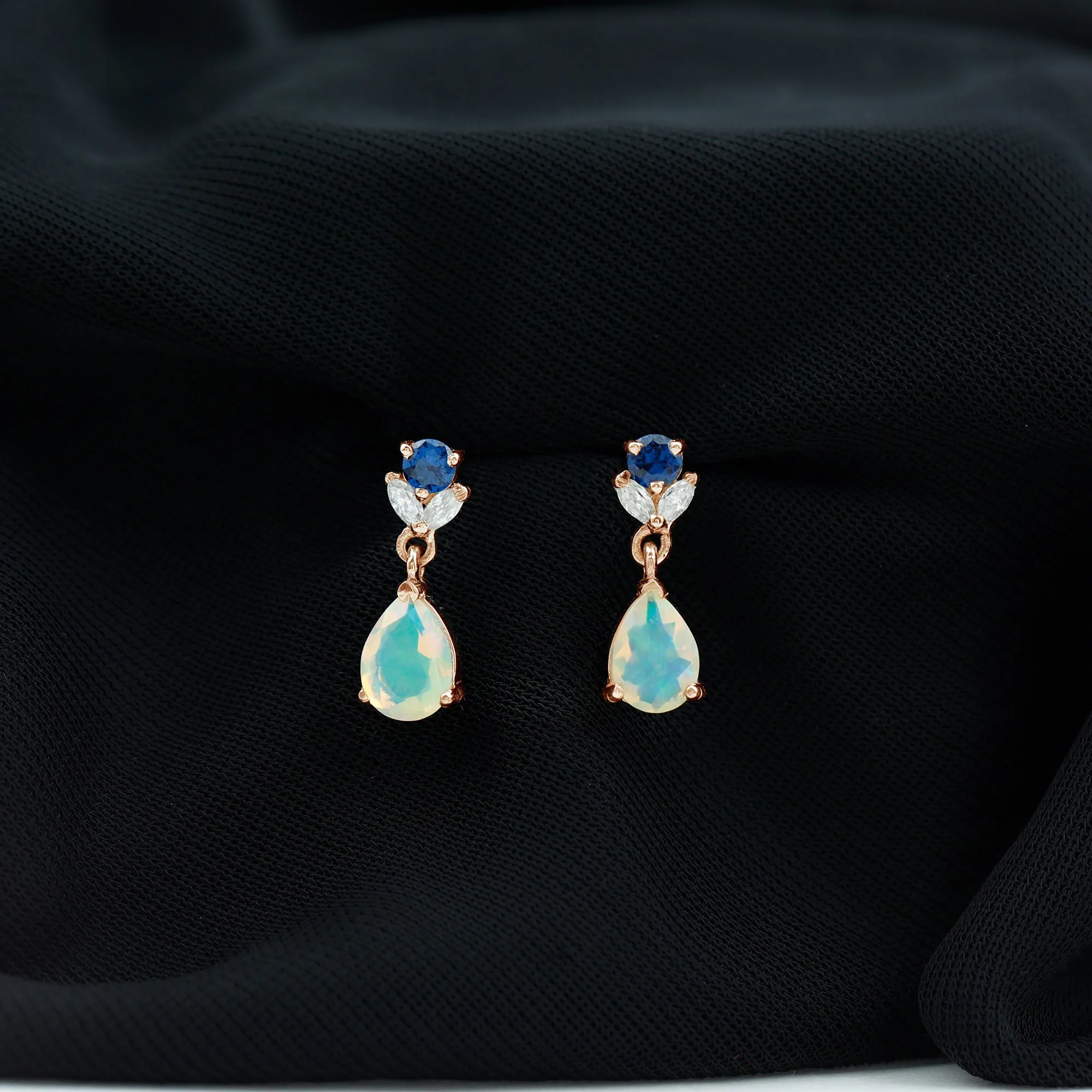 Ethiopian Opal and Created Blue Sapphire Dangle Earrings with Moissanite