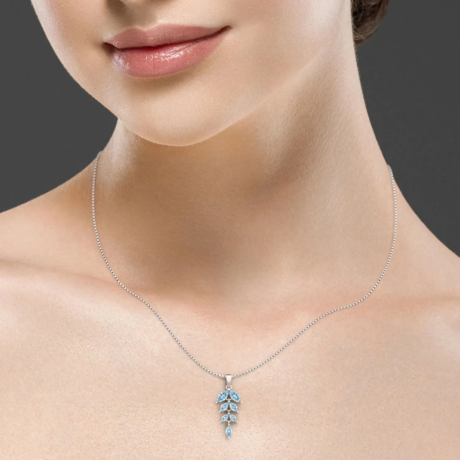 Sparkling Topaz Leaf Pendant: A Touch of Timeless Elegance